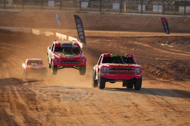 CORR pro trucks racing side by side
